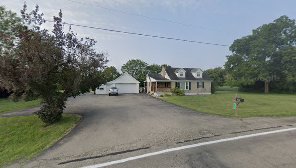 House with driveway and garage.